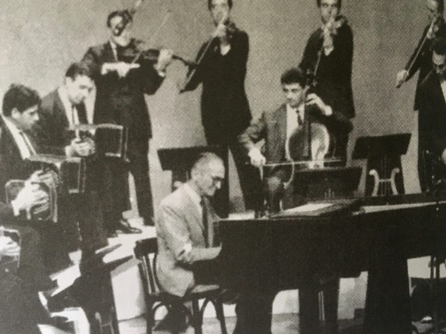 Vintage tango orchestra with bandoneón, violins, double bass and piano